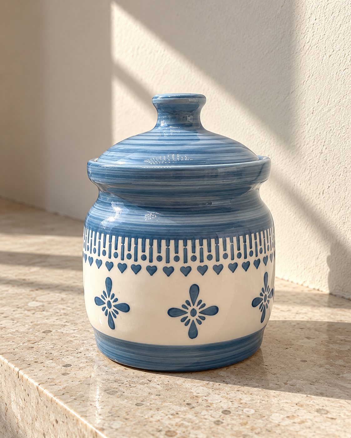 Grey Floral Border Ceramic Pickle Jar - 1000 ml, photographed in natural sunlight