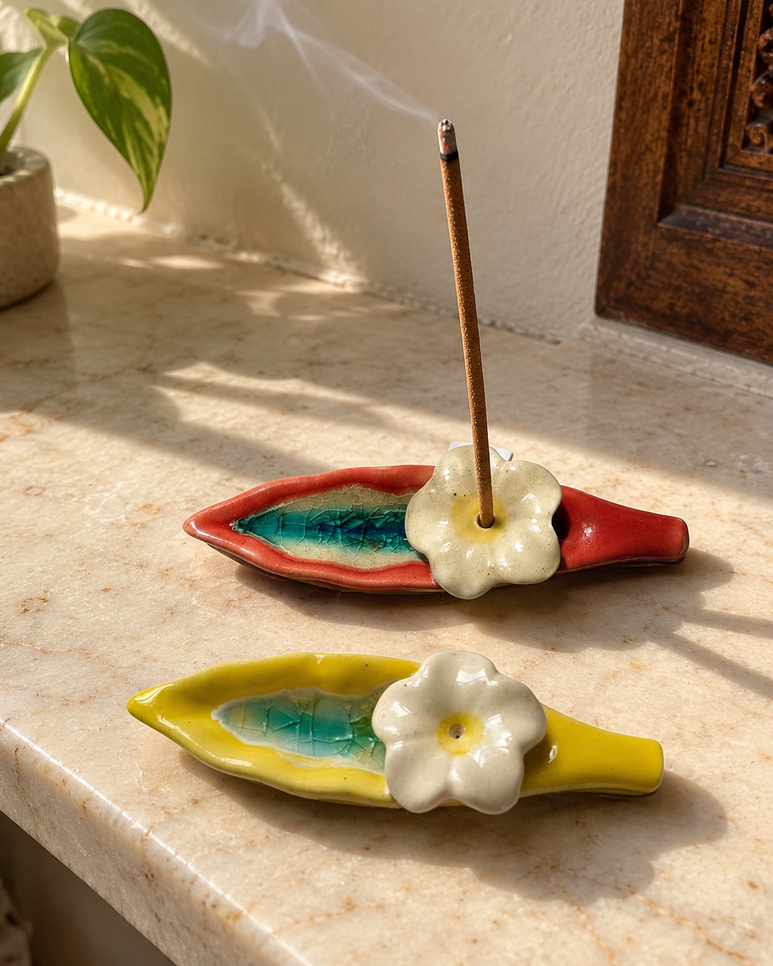 Leaf and Flower Ceramic Incense Holders - Red and Yellow, Set of 2, styled in a home setting
