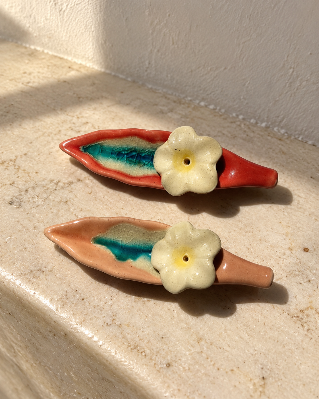 Leaf and Flower Ceramic Incense Holders - Red and Pink, Set of 2, photographed in natural sunlight
