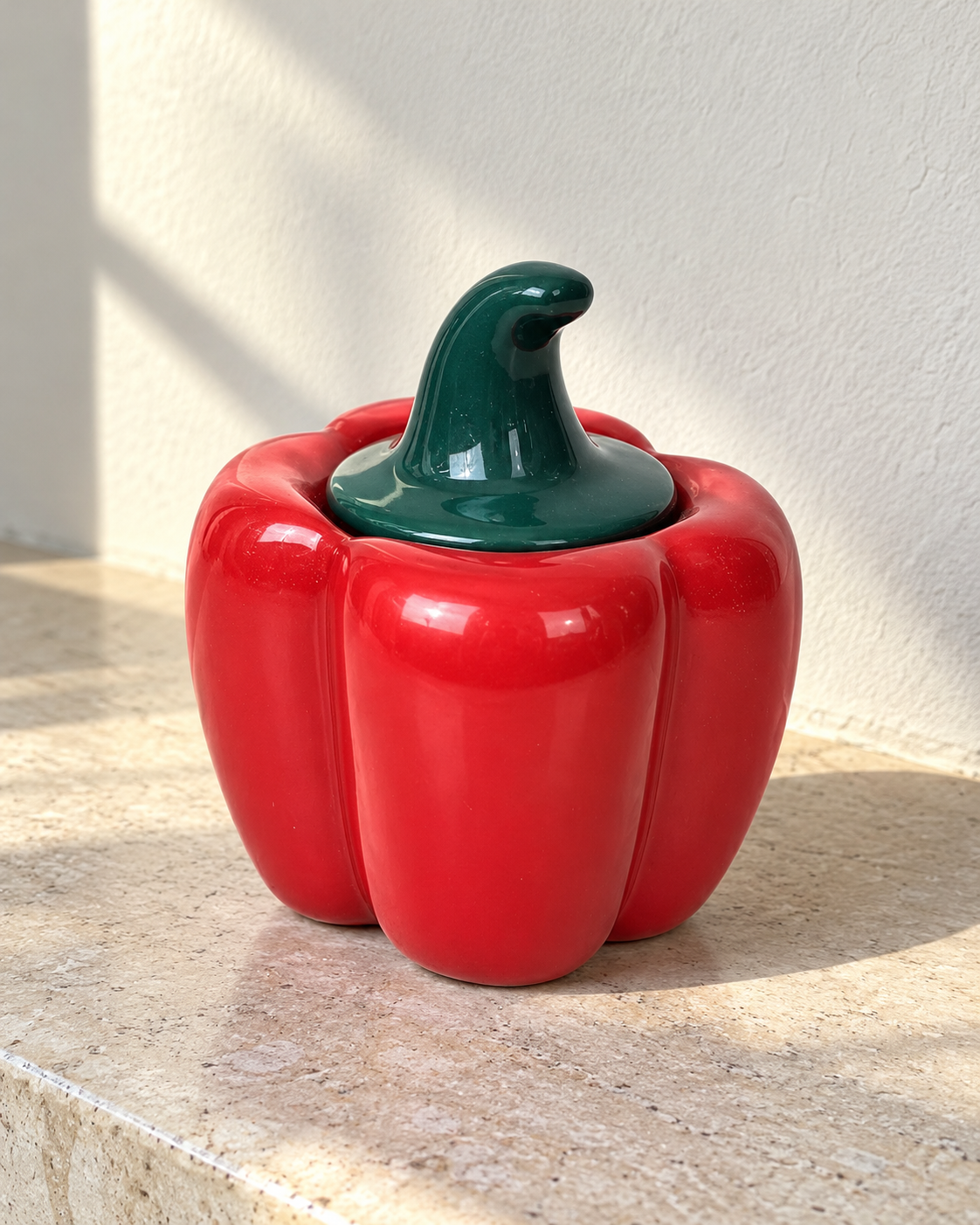 Red Capsicum Ceramic Pickle Jar - 500 ml, photographed in natural sunlight