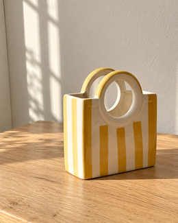 Yellow Striped Ceramic Basket Vase, photographed in natural sunlight
