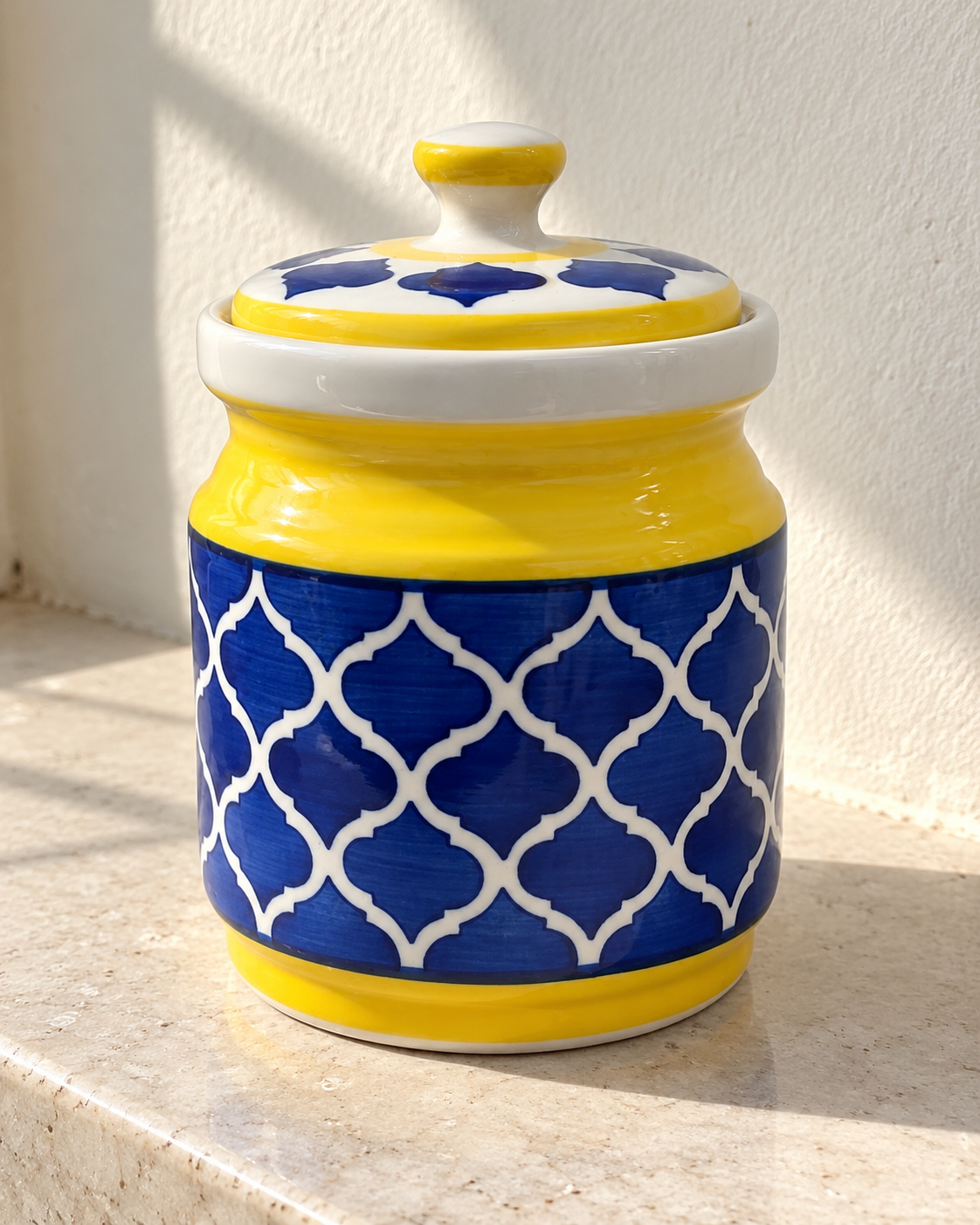 Yellow and Blue Geometric Ceramic Pickle Jar - 1200 ml, photographed in natural sunlight