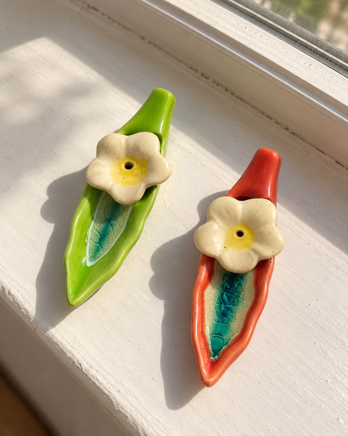 Leaf and Flower Ceramic Incense Holders - Red and Green, Set of 2, photographed in natural sunlight