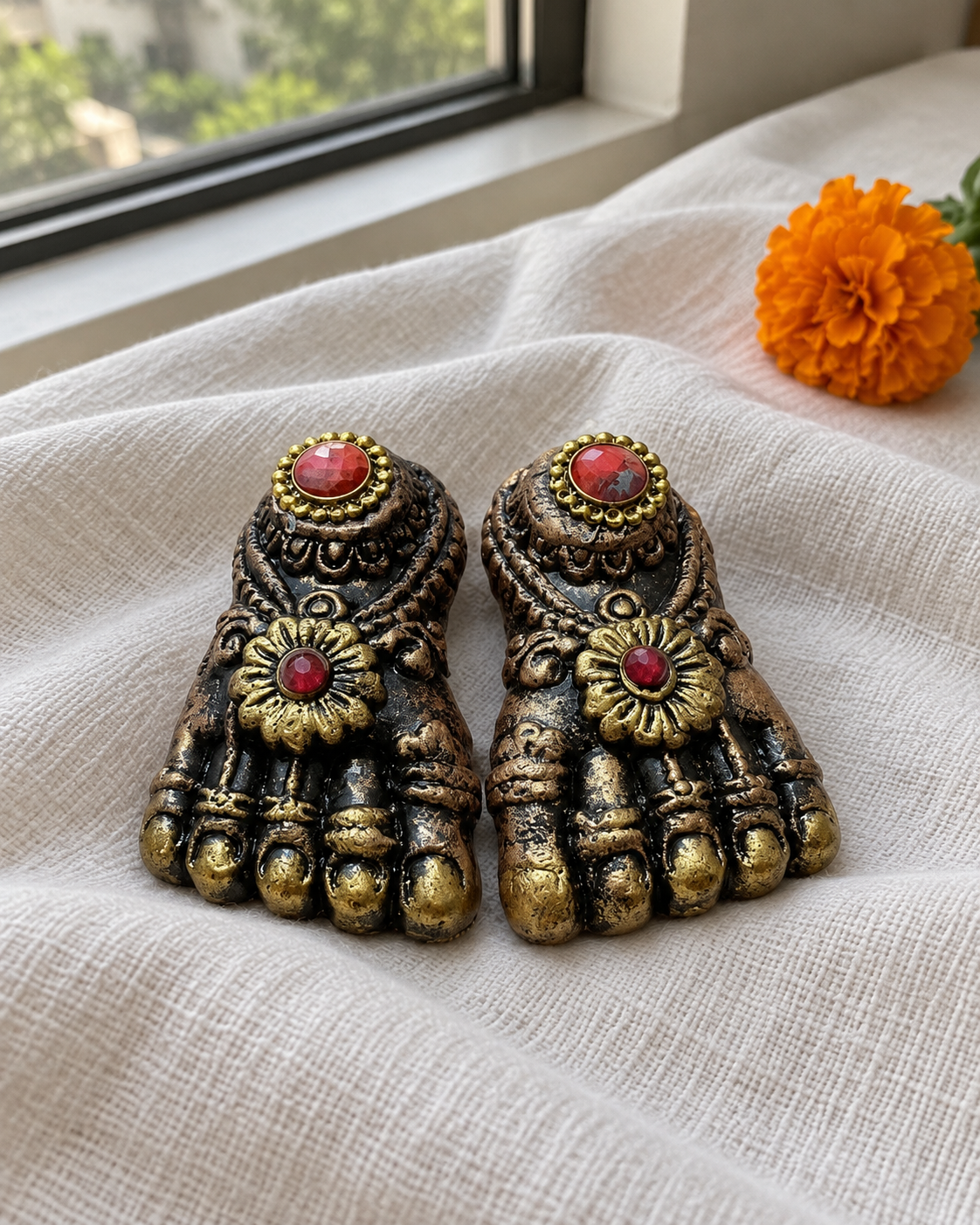 Antique Gold Lakshmi Charan - Pair, displayed on fabric