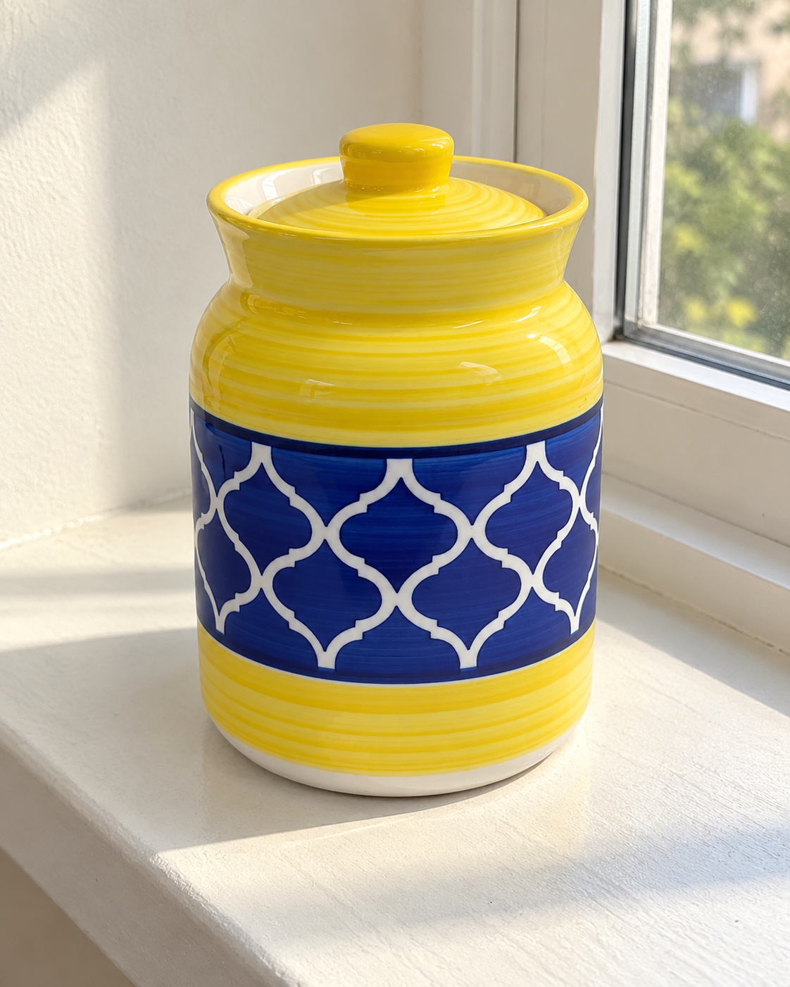Yellow and Blue Geometric Ceramic Pickle Jar - 1000 ml, photographed in natural sunlight