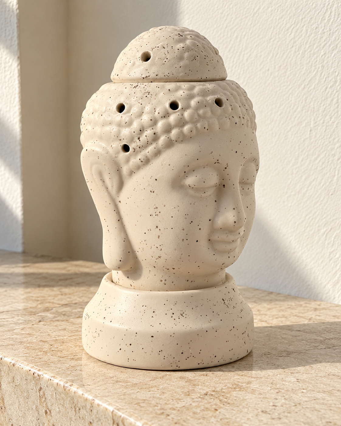 Buddha Shape Electric Ceramic Aroma Diffuser, photographed in natural sunlight