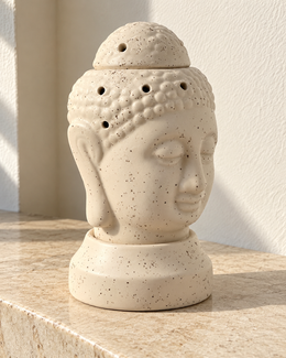 Buddha Shape Electric Ceramic Aroma Diffuser, photographed in natural sunlight