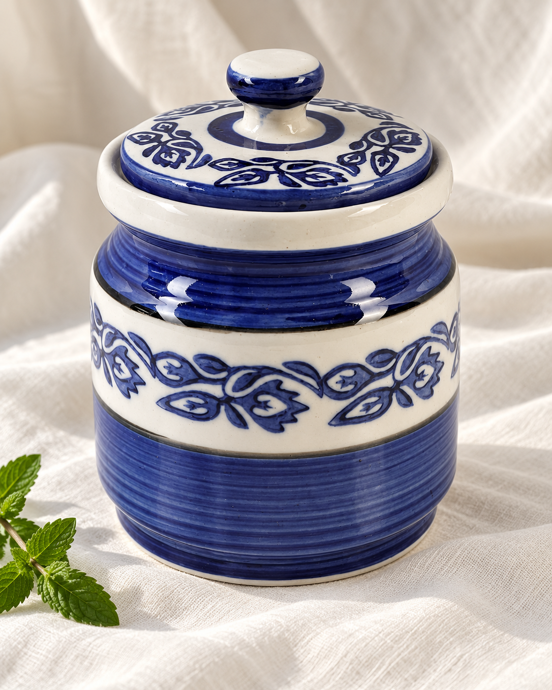 Blue Floral Ceramic Pickle Jar - 1200 ml, displayed on fabric