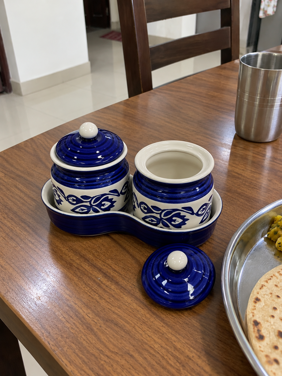 Blue Floral Ceramic Jar Set of 2 — open detail view on a dining table