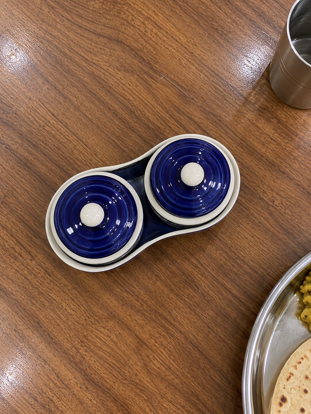 Blue Floral Ceramic Jar Set of 2 — overhead view on a dining table
