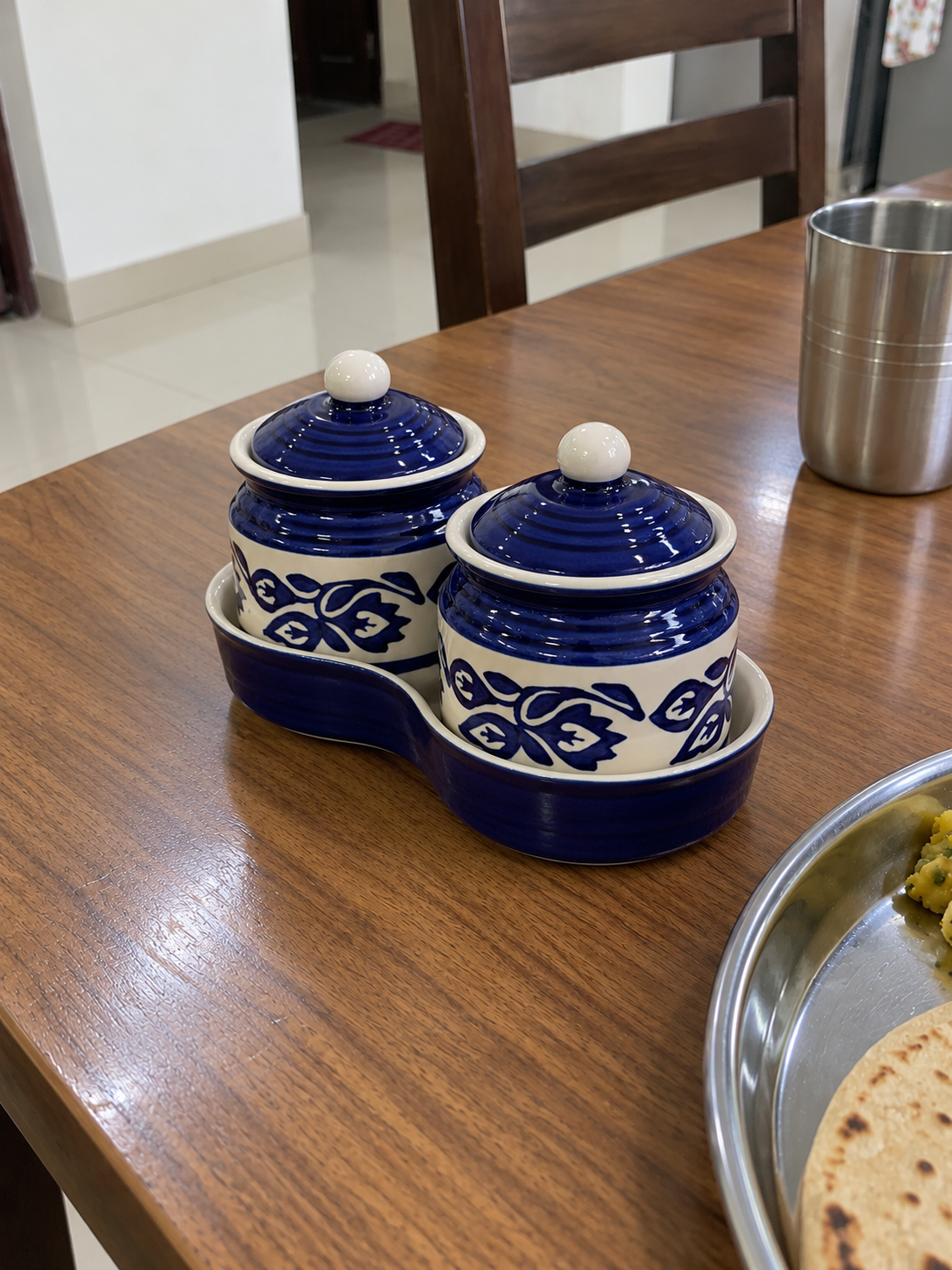 Blue Floral Ceramic Jar Set of 2 — side view on a dining table