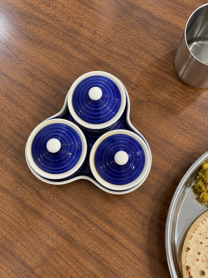 Blue Floral Ceramic Jar Set of 3 — overhead view on a dining table