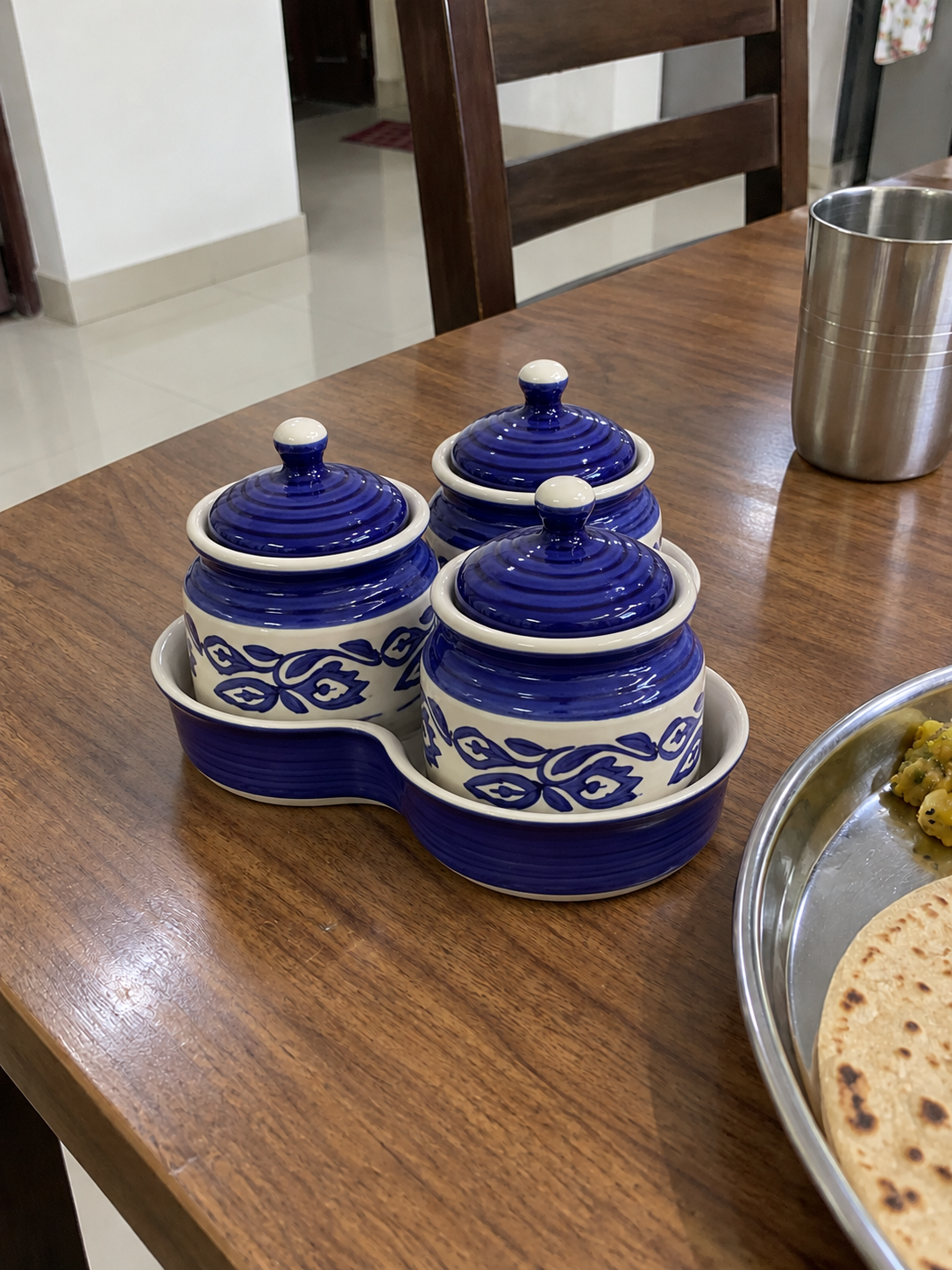 Blue Floral Ceramic Jar Set of 3 — side view on a dining table