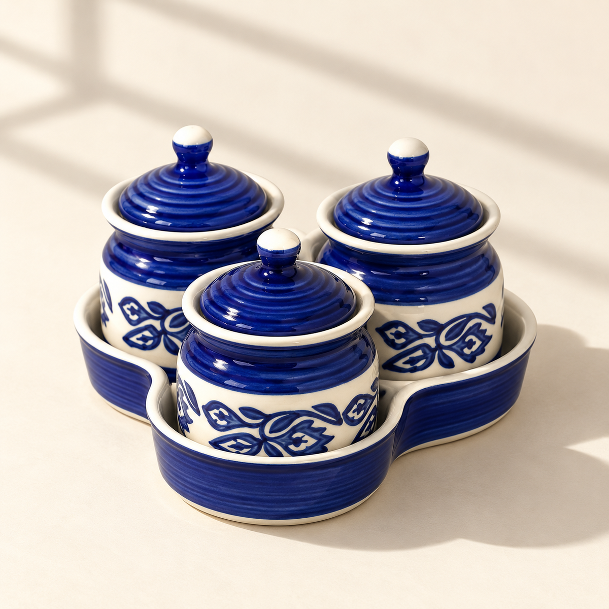Blue Floral Ceramic Jar Set of 3 with matching lids and tray on a plain ivory backdrop