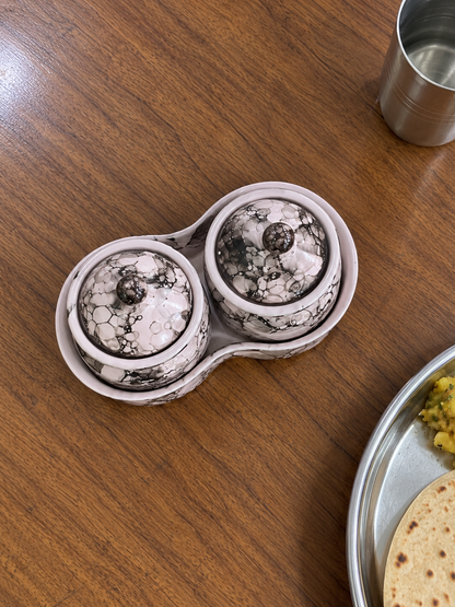 Blush Grey Marble Ceramic Jar Set of 2 — overhead view on a dining table