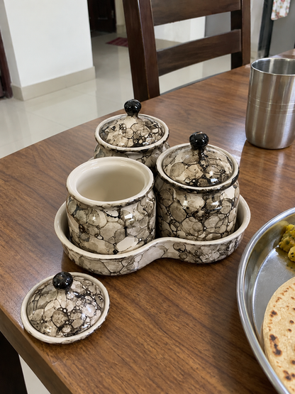 Grey Marble Ceramic Jar Set of 3 — open detail view on a dining table