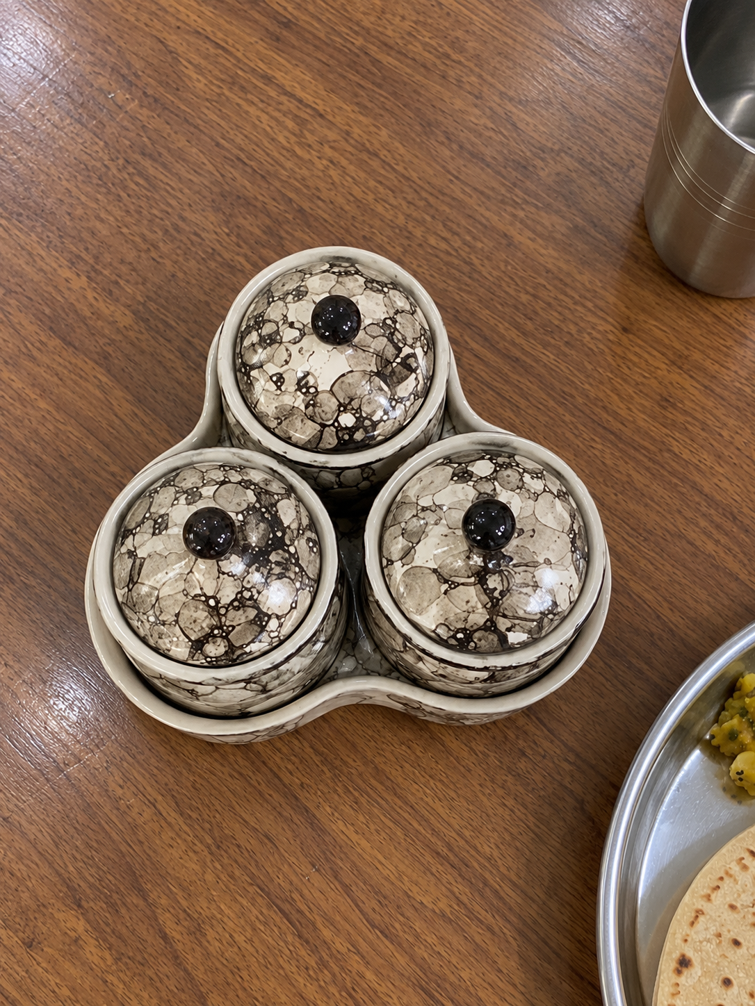 Grey Marble Ceramic Jar Set of 3 — overhead view on a dining table