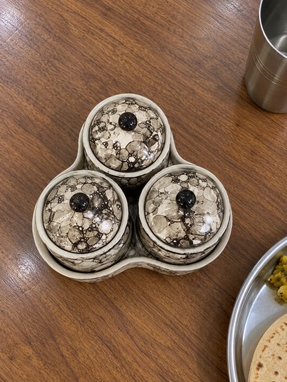 Grey Marble Ceramic Jar Set of 3 — overhead view on a dining table