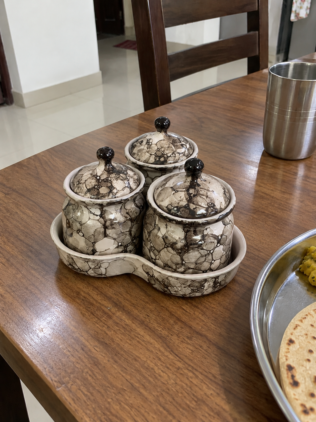 Grey Marble Ceramic Jar Set of 3 — side view on a dining table