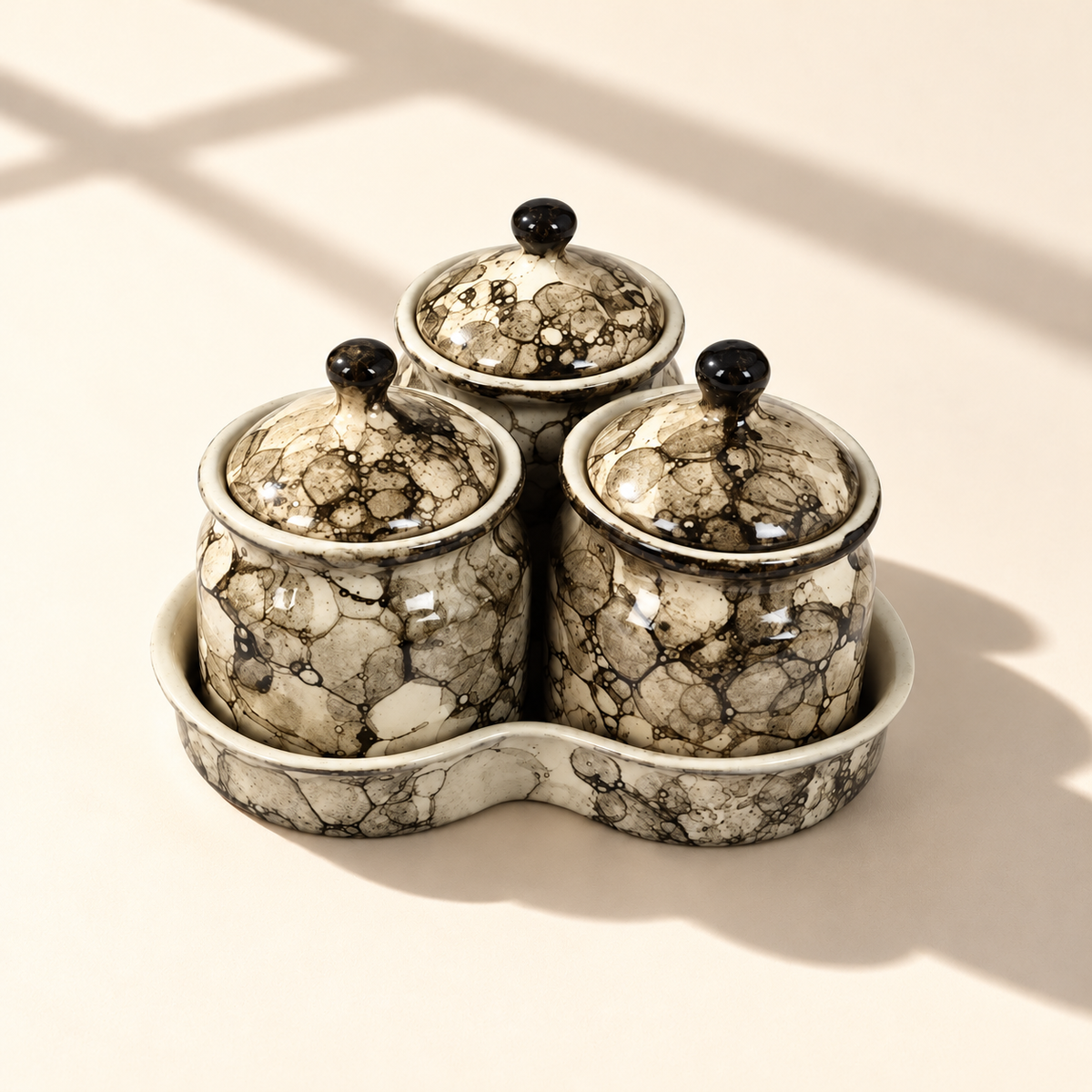 Grey Marble Ceramic Jar Set of 3 with matching lids and tray on a plain ivory backdrop
