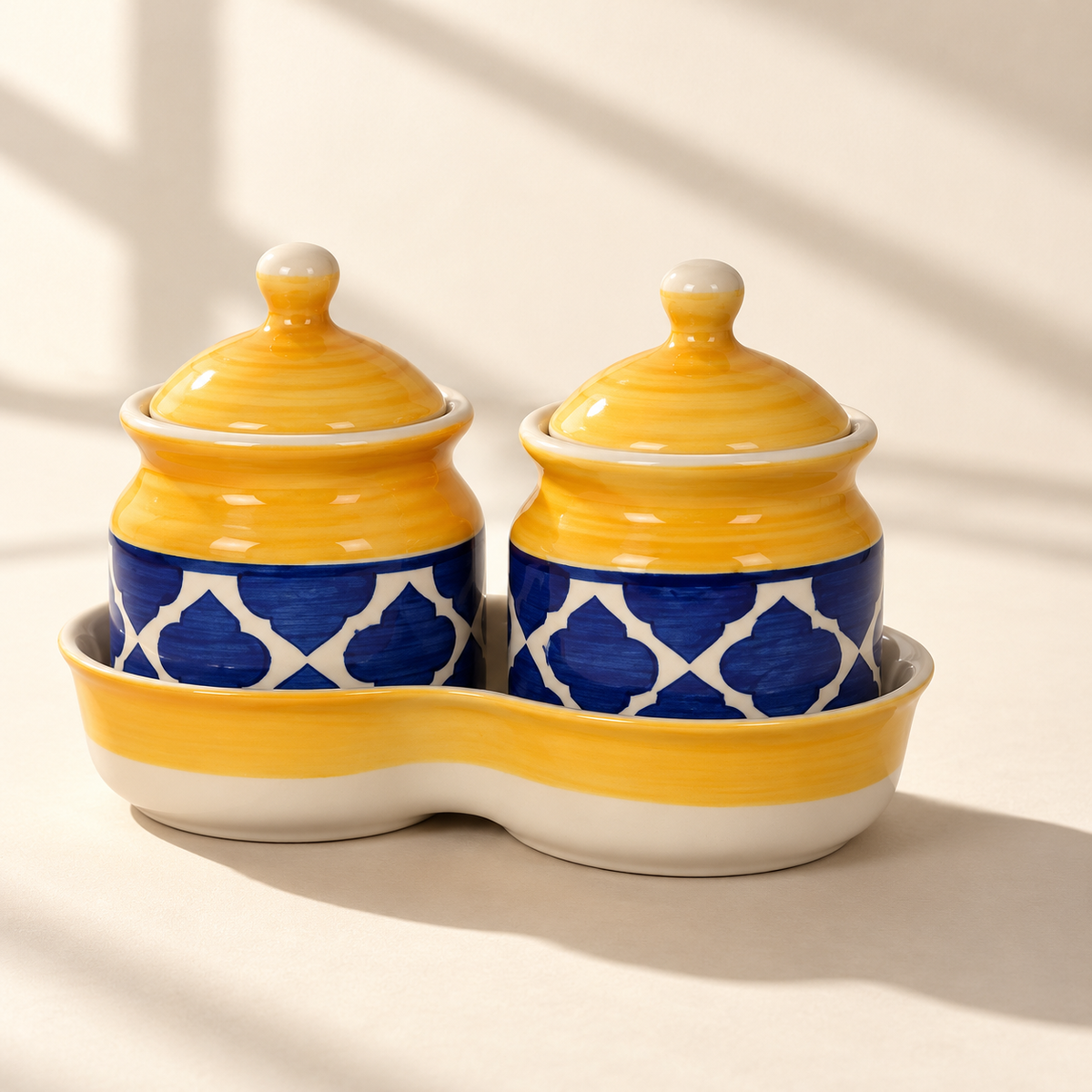 Yellow Geometric Ceramic Jar Set of 2 with matching lids and tray on a plain ivory backdrop